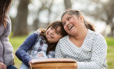 girls share a happy moment at family picnic